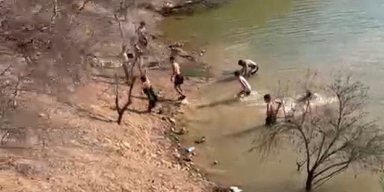 Malatya'da çocuklar gölette serinledi!